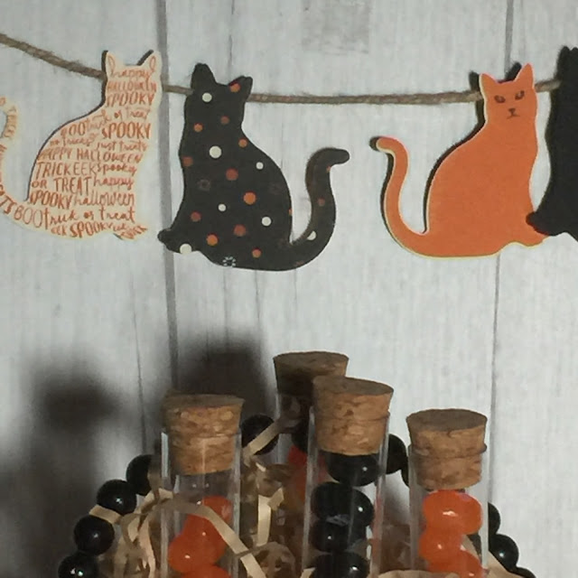 Cat punch and Jute Twine make cute banners for Halloween celebrations