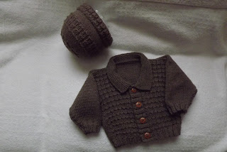 http://www.craftsy.com/pattern/knitting/clothing/baby-waffle-stitch-cardigan/162816
