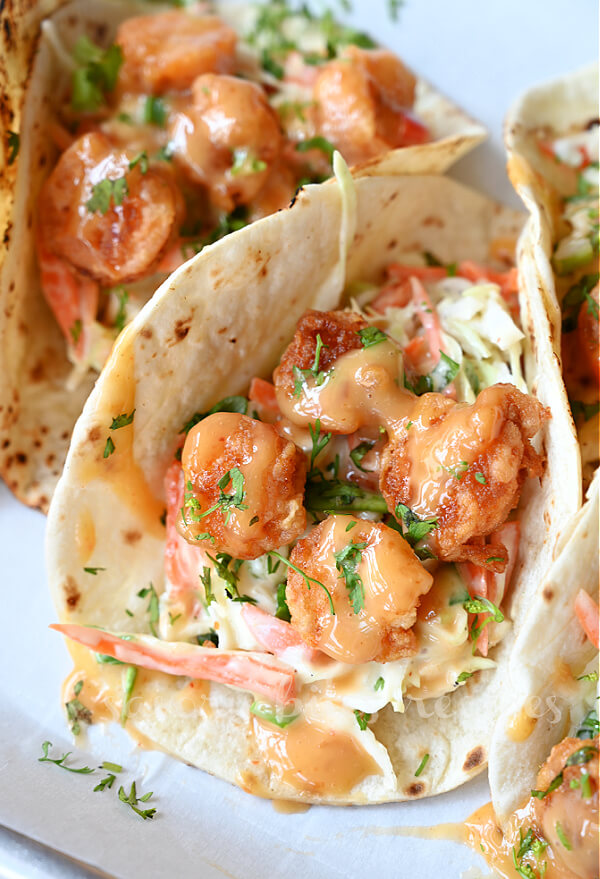 best bang bang shrimp tacos topped with cilantro
