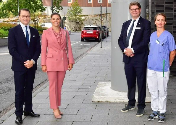 Princess Victoria wore Rodebjer pink suit, blazer and trousers. Rodebjer Xilla silk blouse. Dulong, Kreuger Jewellery pink earrings