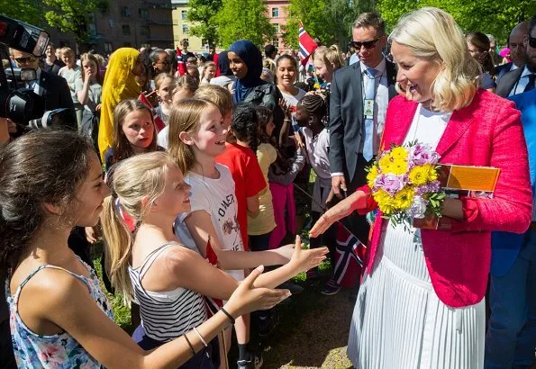 Crown Princess Mette-Marit wore a new Altuzarra skirt with her Prada red jacket and Yvonne Koné suede pumps. The Crown Couple visited Sagene Church