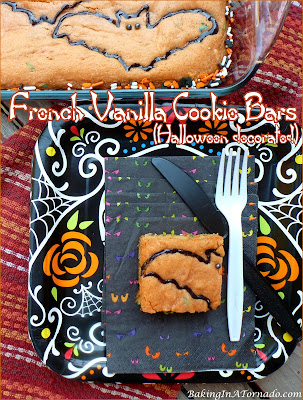 French Vanilla Cookie Bars pictured decorated for Halloween but perfect for any occasion. Starting with mixes for ease, just add a few ingredients, bake and decorate. | Recipe developed by www.BakingInATornado.com | #recipe #bake