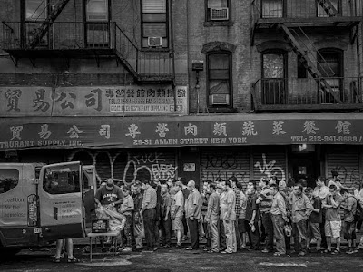 black and white photo of a Food line on Allen Street, New York City, August 11, 2020
