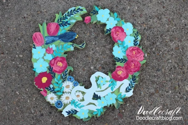 Paint flowers and blue bird on wood cut out wreath for the perfect summertime decor
