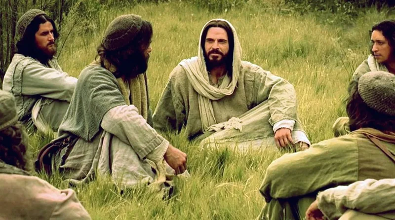 Jesus sentado na relva conversando com seus discipulos