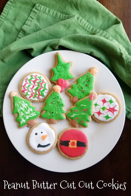 It is always fun to have a cookie cut in a pretty shaped and decorated with frosting, but you aren't limited to sugar cookies. There are lots of flavors and types of cookies you can roll and cut, here are a few of our favorite recipes. peanut butter cookies cut in Christmas shapes and decorated with royal icing