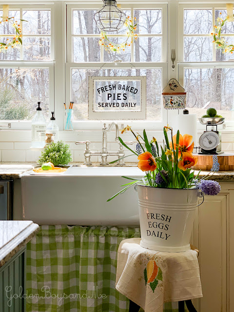Cozy and Colorful Country Cottage Home Tour, Charming kitchen farmhouse sink, vintage style bridge faucet, windows and Spring flowers. Cozy and Colorful Country Cottage Home Tour