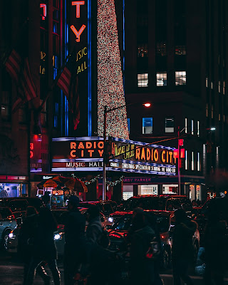 Seeing the Rockettes at Radio City Music Hall | Photo by Arthur Osipyan on Unsplash Radio City Music Hall promoting Christmas show at night