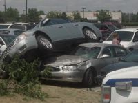 PHOTO :13-Year-old girl Parks Car on Top of two Other Cars