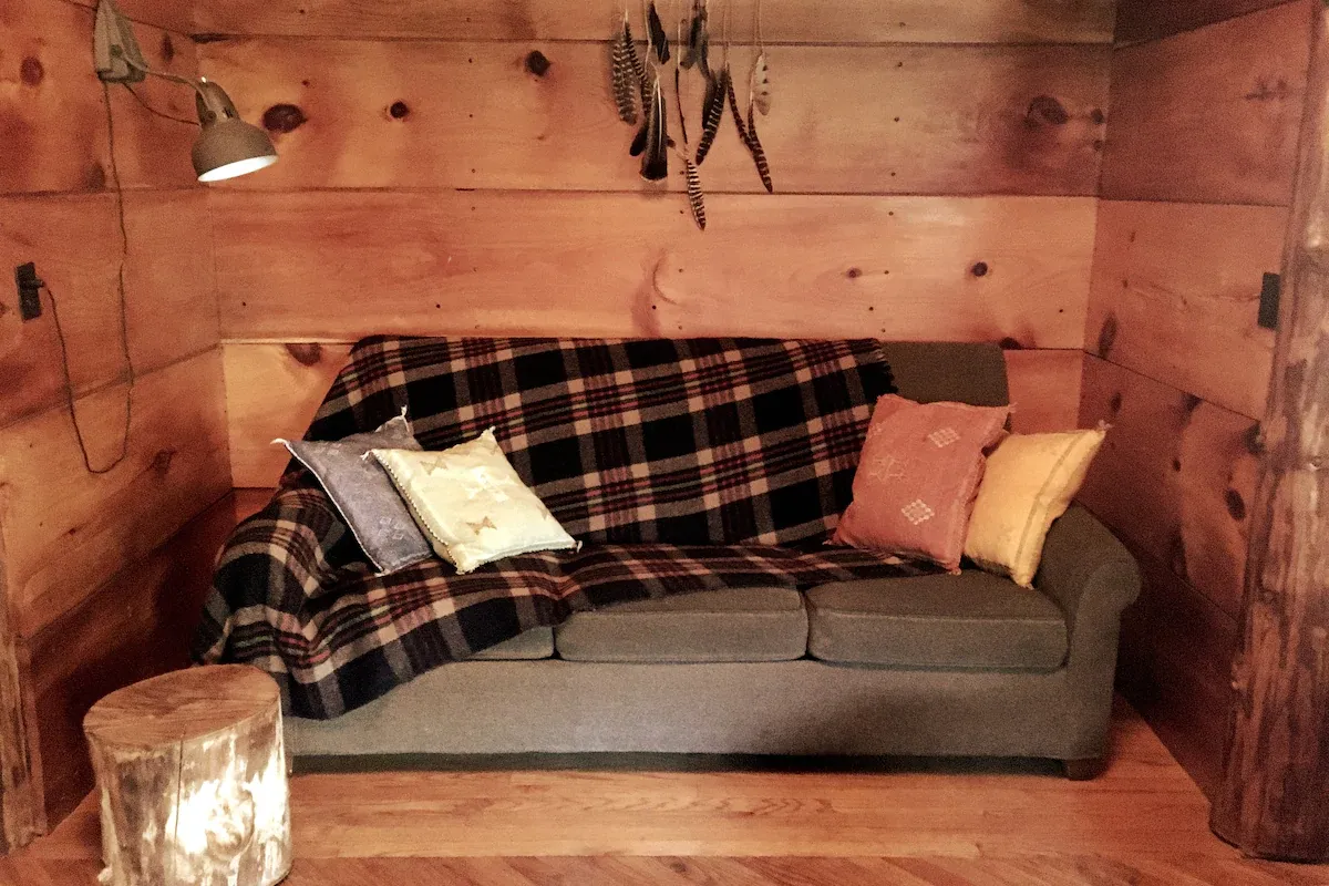 Log-Cabin-available-for-rent-on-airbnb-in-new-york-couch