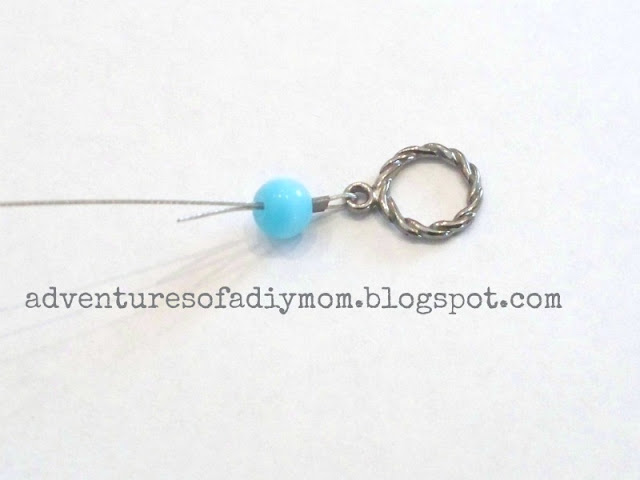 adding beads to wire bracelet