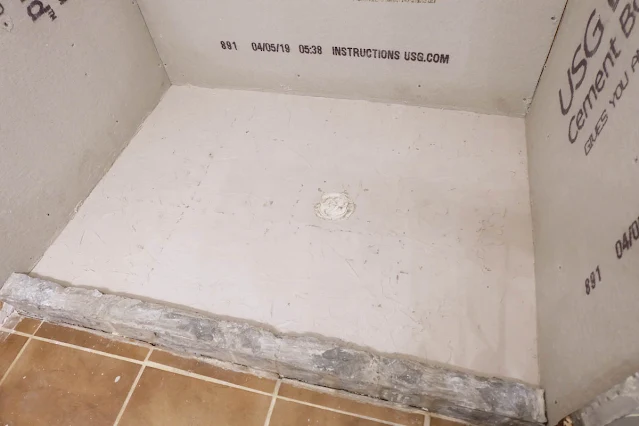 patching shower base concrete with skim coat