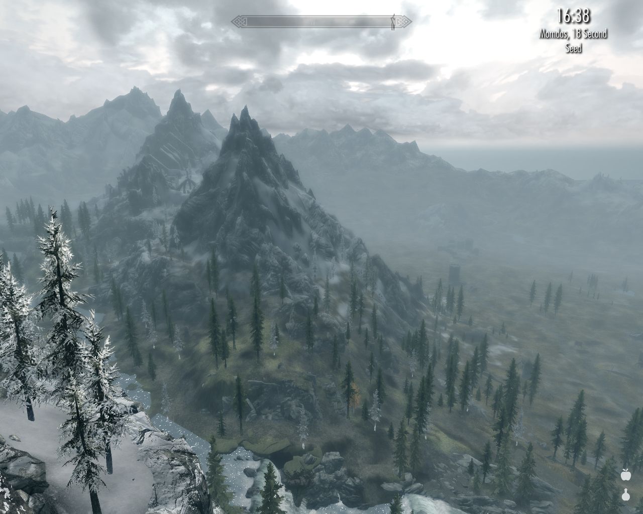 view down very high mountains, Bleak Falls Barrow visible between mountain ranges, partially cloudy sky