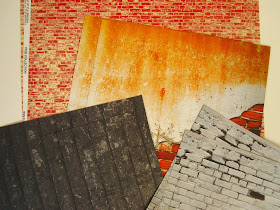 A selection of scrapbook paper sheets with distressed brick, plaster and wood patterns.