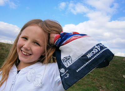 girl showing her support to olympic team gb  next scraf