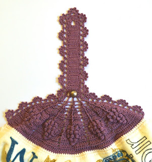 The photo is a close-up of the tea towel top. The textured stitches can be clearly seen.
