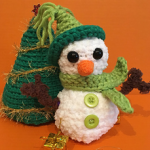 http://www.ravelry.com/patterns/library/christmas-scene-snowman-and-tree