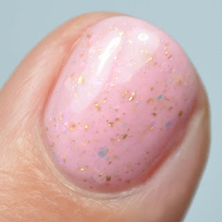 pale pink nail polish with flakies