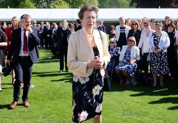The Princess Royal and Princess Beatrice. Princess Anne wore a floral dress