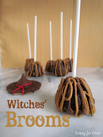 brownie bites on sticks decorated like brooms