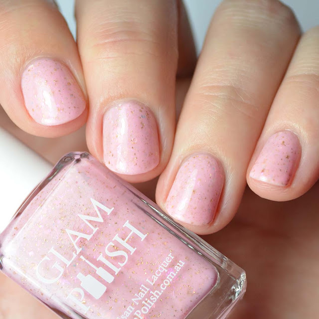 pale pink nail polish with flakies