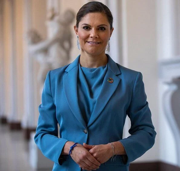 Princess Victoria wore a blue narina blazer from Tiger of Sweden, and a mist blue silk satin blouse from same brand