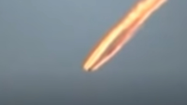 Meteorite or UFO speeding through the atmosphere.