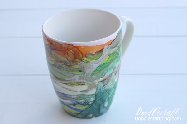 Use Alcohol inks to create a stunning work of abstract art on a ceramic mug for the perfect holiday gift. With full video tutorial instructions too!