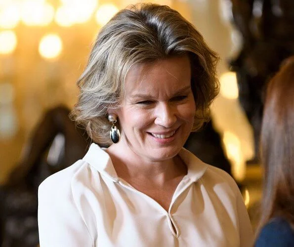 Queen Mathilde of Belgium held a new year's reception at the royal palace in Brussels. Queen Mathilde wore a skirt by Natan