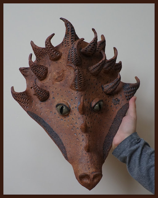 Beautiful ceramic dragon mask by Lily L.