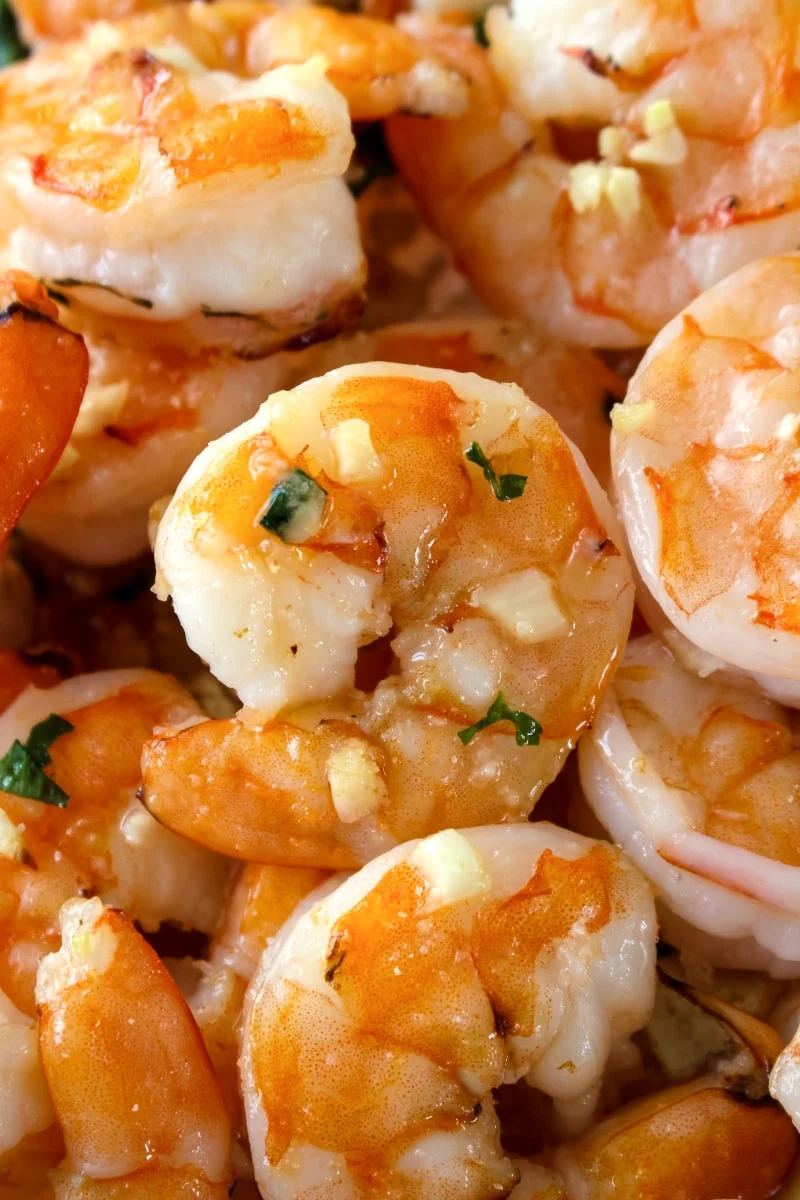 10 Minute Garlic Butter Baked Shrimp is an easy recipe for perfectly cooked, garlicky, buttery shrimp that is baked on a sheet pan in just 10 minutes! #shrimp #sheetpan #seafood