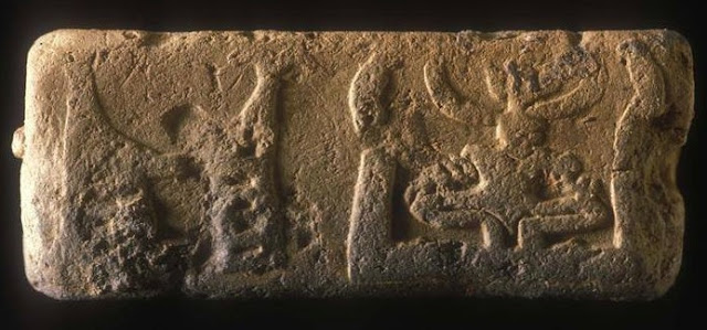 Horned deity sitting beside a structure, Harappa molded tablet H95-2487/4466-01.