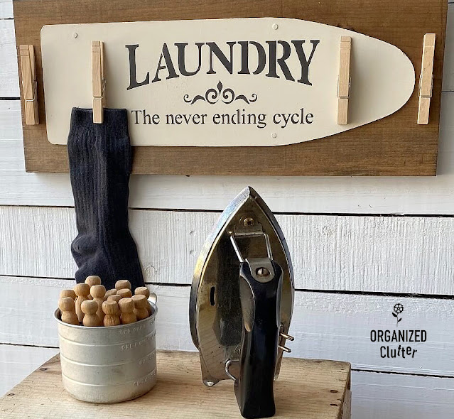 Photo of laundry room sign with clothespins