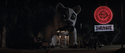 A movie still showing the Bulldog Cafe at night.