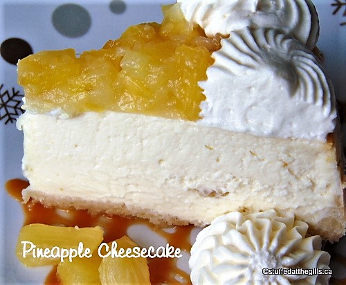 A slice of Pineapple Cheesecake with whipped cream and caramel sauce.