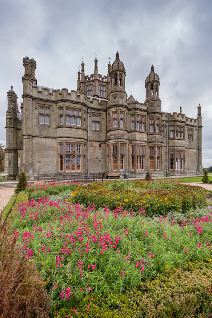 Flowers bloom in front of Margam Castle in South Wales by Martyn Ferry Photography