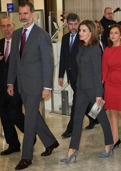 Queen Letizia carries Madmacarena python snake clutch bag. Uterque shoes, diamond jewellery earring