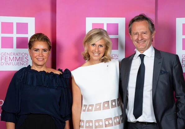 Grand Duchess Maria Teresa wore a navy blue round neck puff sleeve ruffled blouse