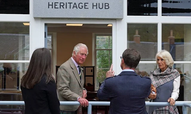 Duchess of Cornwall wore a chic check dress that featured a unique grey waistcoat style top