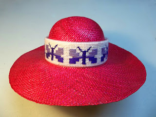 Red hat with needlepoint band