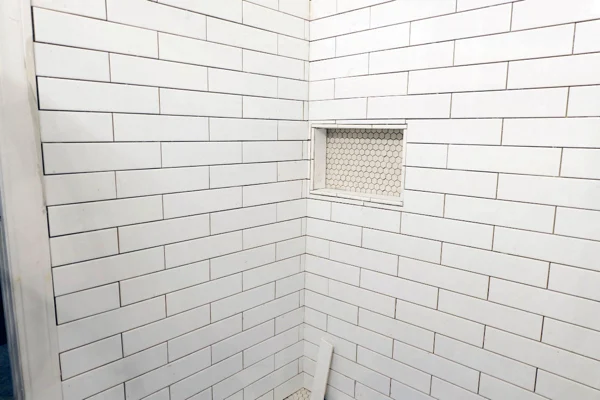 progress in shower wall tile with niche