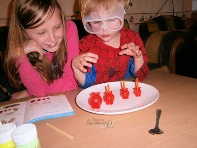 children having fun with science kit