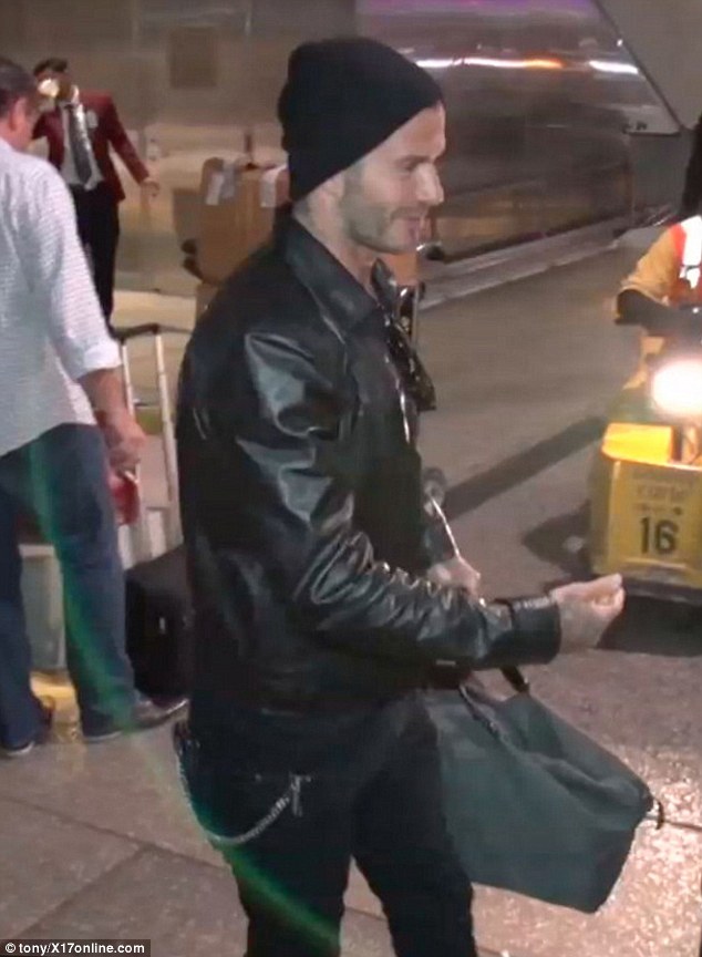 David Beckham arrives at Los Angeles International Airport wearing