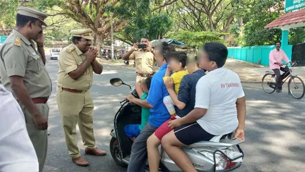 Vehicle inspector folds hands, bows before man riding scooter with 4 kids, Kochi, News, Local-News, Humor, Auto & Vehicles, Inspection, Children, Passengers, Kerala.