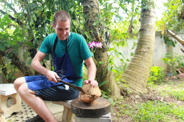 Thai Secret Cooking Class Cracking coconuts to make home made coconut milk. June 22-2017