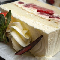 wedding cake slice with fresh strawberry center