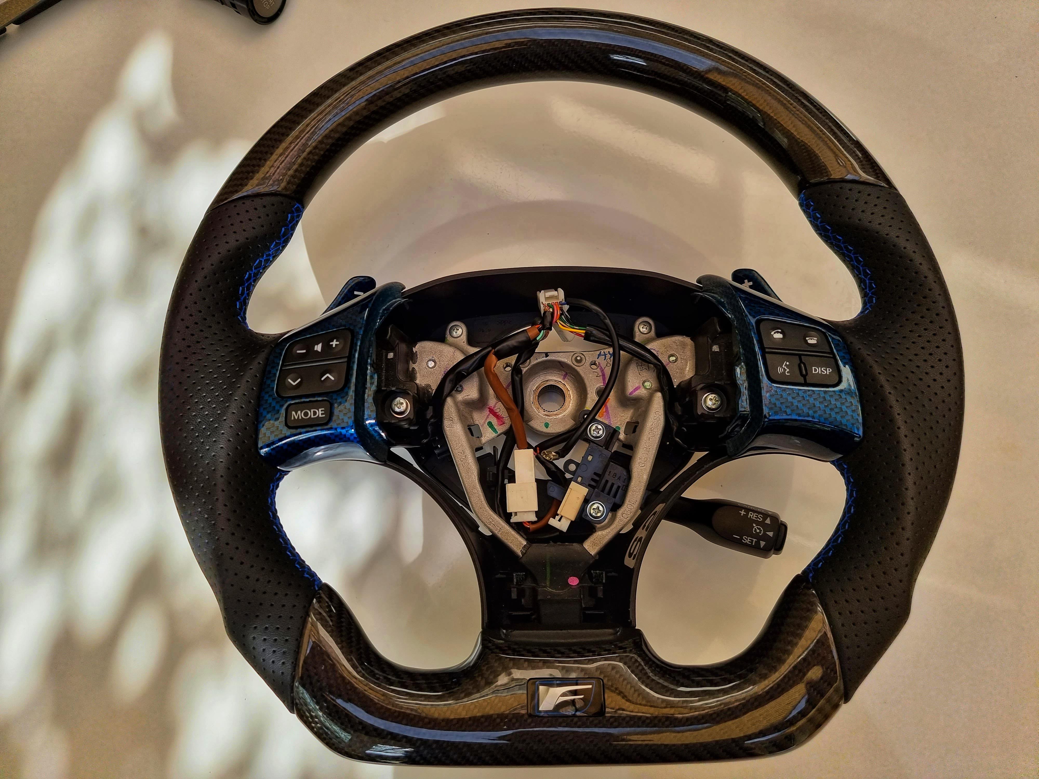 Flat bottom sports steering wheel installed