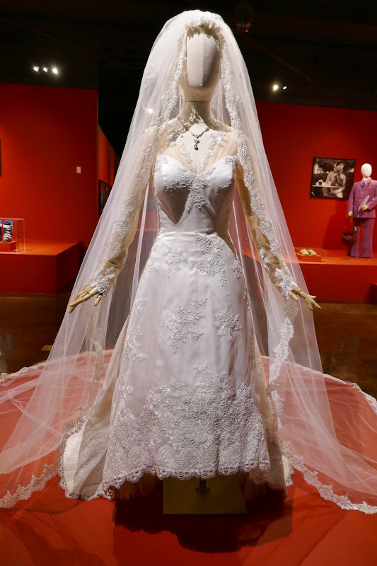 Hollywood Movie Costumes and Props: Wedding dress worn by Gaga in House of Gucci on display...