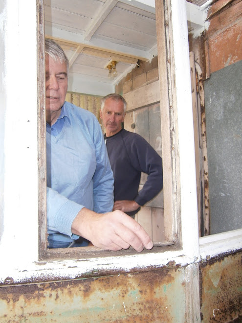 John and Richard work on the cab windows.