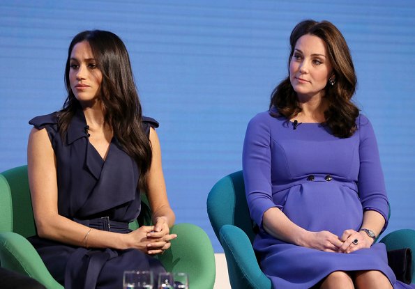 Meghan Markle wore Jason Wu Flared Belted Satin Dress. Kate Middleton wore Seraphine Royal Blue Tailored Maternity Dress. Prince Harry